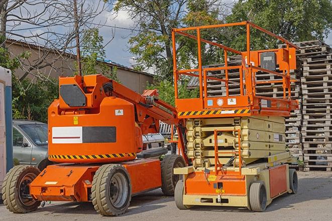 forklift moving pallets of inventory in warehouse in Byron